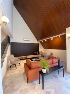 Front view of a luxurious 3-storey bungalow in Jelutong Villas, Damansara Heights, featuring modern architectural design and a beautifully landscaped garden."