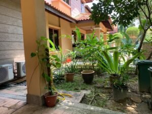 Front view of a luxurious 3-storey semi-detached house in Duta Tropika, featuring modern architectural design and a beautifully landscaped garden."