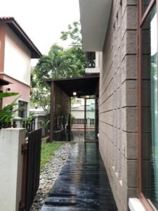 Front view of a luxurious 3-storey semi-detached house in Duta Tropika, featuring modern architectural design and a beautifully landscaped garden."