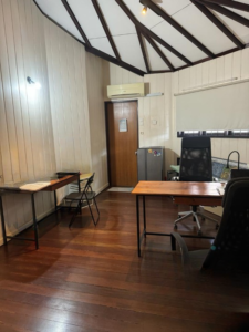 Spacious living area of a partially furnished 6+1 bedroom home in Bukit Tunku, featuring modern and classic design elements.