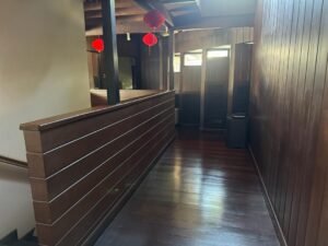 Spacious living area of a partially furnished 6+1 bedroom home in Bukit Tunku, featuring modern and classic design elements.