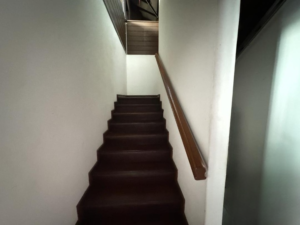 Spacious living area of a partially furnished 6+1 bedroom home in Bukit Tunku, featuring modern and classic design elements.