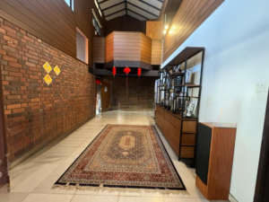 Spacious living area of a partially furnished 6+1 bedroom home in Bukit Tunku, featuring modern and classic design elements.