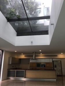 Front view of a luxurious 5-storey bungalow in Bukit Tunku, featuring modern architectural design, a private swimming pool with city views, and surrounded by lush greenery
