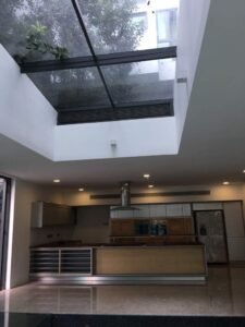 Front view of a luxurious 5-storey bungalow in Bukit Tunku, featuring modern architectural design, a private swimming pool with city views, and surrounded by lush greenery