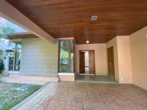 Front view of a luxurious 4-bedroom bungalow in Duta Nusantara, Sri Hartamas, featuring modern architectural design and a beautifully landscaped garden