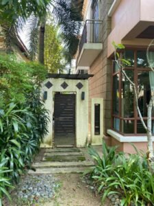 Front view of a luxurious 4-bedroom bungalow in Duta Nusantara, Sri Hartamas, featuring modern architectural design and a beautifully landscaped garden