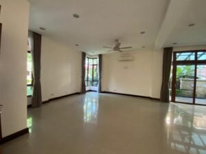 Front view of a luxurious 4-bedroom bungalow in Duta Nusantara, Sri Hartamas, featuring modern architectural design and a beautifully landscaped garden