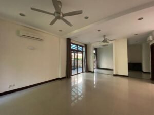 Front view of a luxurious 4-bedroom bungalow in Duta Nusantara, Sri Hartamas, featuring modern architectural design and a beautifully landscaped garden