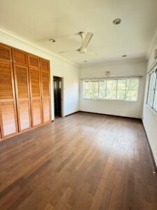 Elegant bungalow for rent in Bukit Tunku, Kuala Lumpur, featuring a private swimming pool, modern interiors, and lush green surroundings.