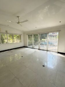Elegant bungalow for rent in Bukit Tunku, Kuala Lumpur, featuring a private swimming pool, modern interiors, and lush green surroundings.