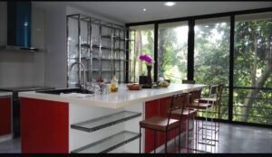 Exterior view of a luxurious bungalow in Jalan Bukit Tunku, Kuala Lumpur, featuring a swimming pool, garage, and spacious interiors