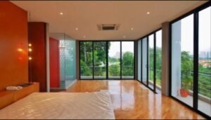 Exterior view of a luxurious bungalow in Jalan Bukit Tunku, Kuala Lumpur, featuring a swimming pool, garage, and spacious interiors