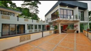 Exterior view of a luxurious bungalow in Jalan Bukit Tunku, Kuala Lumpur, featuring a swimming pool, garage, and spacious interiors