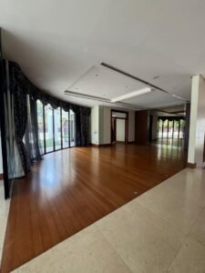 Elegant living area with high ceilings and natural light in Bukit Tunku bungalow