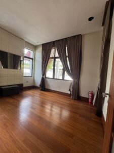 Elegant living area with high ceilings and natural light in Bukit Tunku bungalow