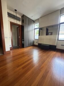 Elegant living area with high ceilings and natural light in Bukit Tunku bungalow