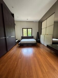 Elegant living area with high ceilings and natural light in Bukit Tunku bungalow