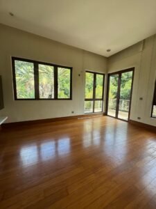 Elegant living area with high ceilings and natural light in Bukit Tunku bungalow