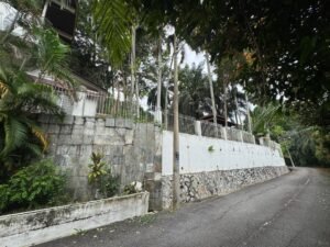 Premium development land in Taman Persiaran Tunku featuring 45,617 sq.ft. across two adjacent lots with private road access in exclusive Kuala Lumpur neighborhood