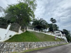 Premium development land in Taman Persiaran Tunku featuring 45,617 sq.ft. across two adjacent lots with private road access in exclusive Kuala Lumpur neighborhood
