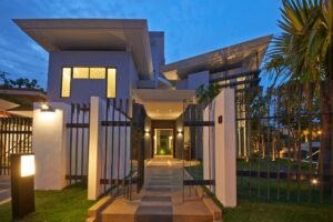 Front view of a luxurious 6-bedroom bungalow in Damansara Heights, featuring a private swimming pool and modern architectural design.