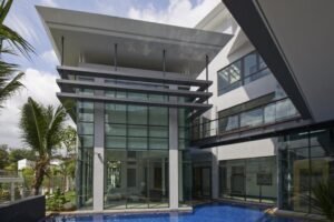 Front view of a luxurious 6-bedroom bungalow in Damansara Heights, featuring a private swimming pool and modern architectural design.