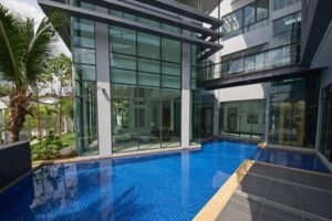 Front view of a luxurious 6-bedroom bungalow in Damansara Heights, featuring a private swimming pool and modern architectural design.