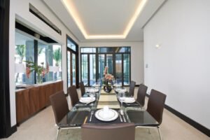 Front view of a luxurious 6-bedroom bungalow in Damansara Heights, featuring a private swimming pool and modern architectural design.