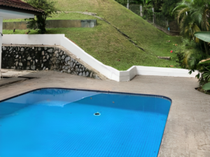 Elegant corner lot bungalow for rent in Bukit Tunku, Kuala Lumpur, featuring a spacious garden, modern interiors, and a bath tub for added comfort.