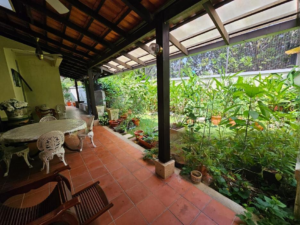 Front facade of a 2-storey bungalow in Impian Bukit Tunku, featuring a private swimming pool and landscaped garden.
