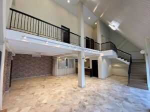 Front view of a luxurious 3-storey bungalow in Jelutong Villas, Damansara Heights, featuring modern architectural design and a beautifully landscaped garden."