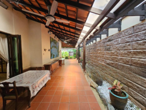 Front facade of a 2-storey bungalow in Impian Bukit Tunku, featuring a private swimming pool and landscaped garden.