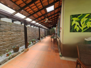 Front facade of a 2-storey bungalow in Impian Bukit Tunku, featuring a private swimming pool and landscaped garden.