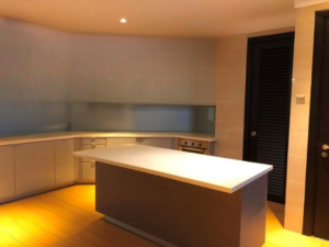 Designer renovated condominium in Bukit Tunku featuring spacious living areas, marble kitchen countertops, and balcony views of greenery and pool in exclusive Kenny Hills neighborhood