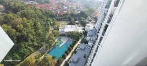 Modern fully furnished one-bedroom condominium in Mutiara Damansara featuring spacious living area, private balcony, and access to swimming pool and tennis courts near popular shopping destinations