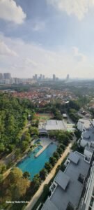Modern fully furnished one-bedroom condominium in Mutiara Damansara featuring spacious living area, private balcony, and access to swimming pool and tennis courts near popular shopping destinations