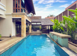 Luxurious bungalow in Tijani 2 South featuring spacious living areas, six bedrooms, and surrounded by lush greenery in exclusive low-density Bukit Tunku neighborhood