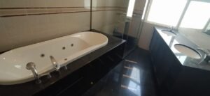 Luxurious duplex penthouse in Bukit Tunku featuring 7 bedrooms, modern facilities including swimming pool and gym, and panoramic views from private balcony in exclusive Kenny Hills neighborhood