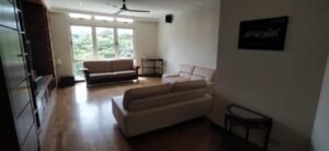 Luxurious duplex penthouse in Bukit Tunku featuring 7 bedrooms, modern facilities including swimming pool and gym, and panoramic views from private balcony in exclusive Kenny Hills neighborhood