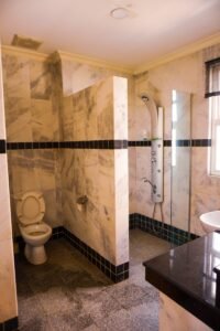 Spacious freehold bungalow in Bangsar, Kuala Lumpur featuring 12,000 sq.ft. built-up, 5+2 bedrooms, private garden, and prime location near BSC and Pantai Hospital.